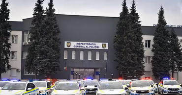 A fleet of Moldovan police cars parked in front of the General Police Inspectorate building.