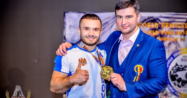 Daniel Procopciuc wearing a Moldovan sports jersey and holding a gold medal.