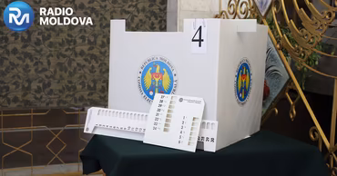 A ballot box with the Central Electoral Commission of Moldova logo.