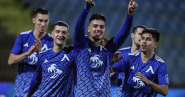 Players of the Levski Trakia football team celebrating a goal on the field.