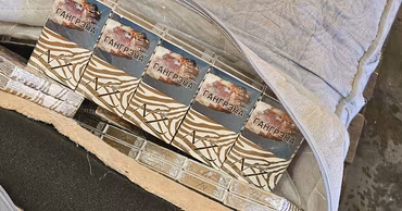Packs of cigarettes hidden inside a bag, seized by customs authorities.