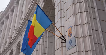 The building of the Romanian Ministry of Finance with the Romanian flag displayed.