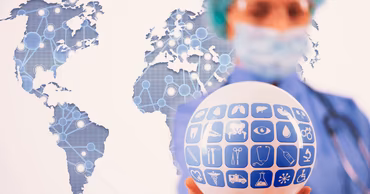 A medical professional holding a globe with medical icons against a world map background.