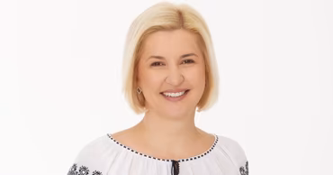Portrait of Moldovan Minister of Agriculture Ludmila Catlabuga wearing a traditional blouse.