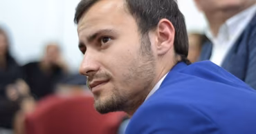 A portrait of Moldovan politician Dinu Plîngău.