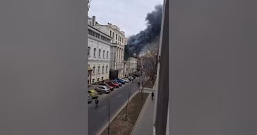 Thick black smoke rising from the roof of a building on Pushkin Street in Chisinau.