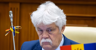 Vasile Sova sitting in the Moldovan Parliament.