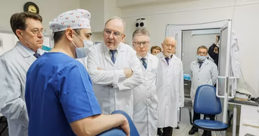 Medical staff and officials in white coats at the Cardiology Institute in Moldova.