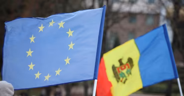 Flags of the European Union and Moldova waving side by side.
