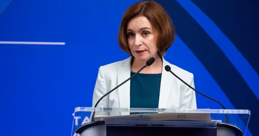 Maia Sandu speaking at a podium during an official event.