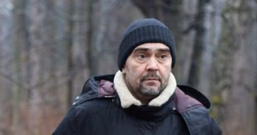 Portrait of Dmitry Konstantinov wearing a black beanie and a winter jacket.