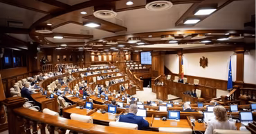The interior of the Parliament of the Republic of Moldova during a session.