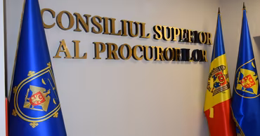 The logo and flags of the Superior Council of Prosecutors of Moldova.