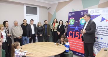 A group of people attending a CNSM event with an ILO banner in the background.