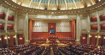 Interior view of the Romanian Parliament plenary hall during a session.