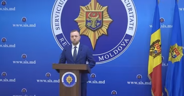 A Moldovan Security and Intelligence Service official speaking at a press conference.
