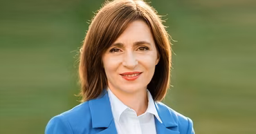Portrait of Moldovan President Maia Sandu wearing a blue blazer.