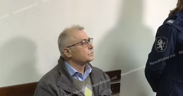 Ion Creanga sitting in a courtroom during his trial.