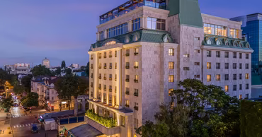 Exterior view of the Radisson Blu Leogrand hotel in Chisinau at dusk.
