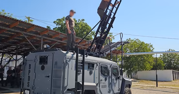 A Roshel armored vehicle with Moldovan police officers during a training exercise.