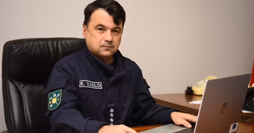Rosian Vasiloi, former head of the Moldovan Border Police, sitting at his desk.