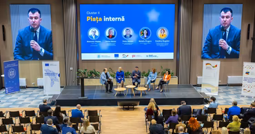 A panel discussion at a conference with a representative from the National Bank of Moldova.