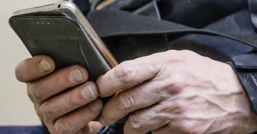 Close-up of a person's hands holding a smartphone.