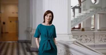 Maia Sandu standing in a building interior.