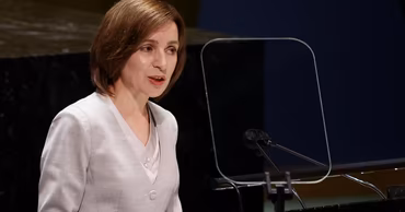 Maia Sandu speaking at a podium.