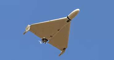 A Shahed-136 drone flying in the sky.