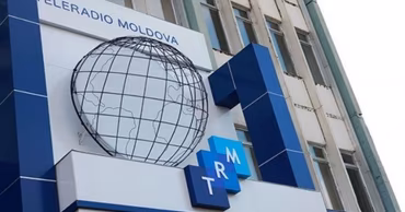 The Teleradio-Moldova building facade with the company logo and globe symbol.