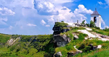 A scenic view of the Old Orhei monastery complex on a cliff in Moldova.