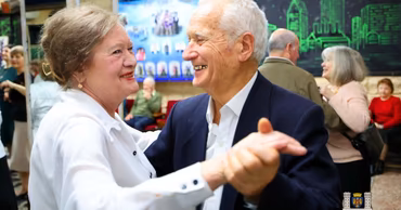 An elderly couple dancing at a cultural event organized by the Chisinau City Hall.