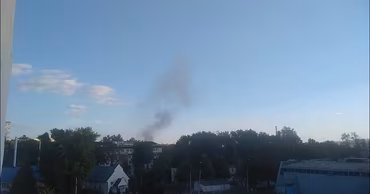 A plume of smoke rising above a residential area in Chisinau.