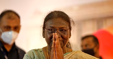 Indian President Droupadi Murmu with hands joined in a traditional greeting gesture.