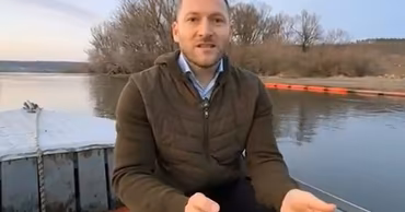 Moldovan Minister of Environment Sergiu Lazarencu speaking on a boat on the Dniester river.
