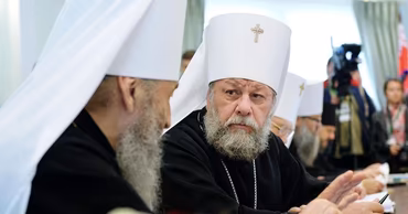 Metropolitan Vladimir and other Orthodox clergy attending a formal meeting or conference.