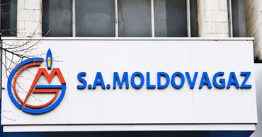 The logo and sign of the Moldovagaz company on the facade of its office building.