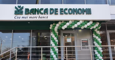 Exterior of a Banca de Economii branch office in Moldova decorated with balloons.