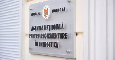 The sign of the National Agency for Energy Regulation of Moldova on a building wall.