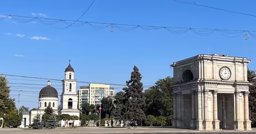 The Triumphal Arch and the Metropolitan Cathedral in Chisinau on a sunny day.