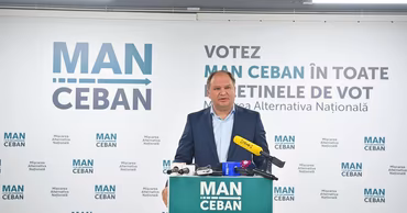 Ion Ceban speaking at a press conference with MAN party branding in the background.