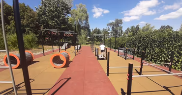 A modern outdoor playground with exercise equipment in La Izvor park in Chisinau.
