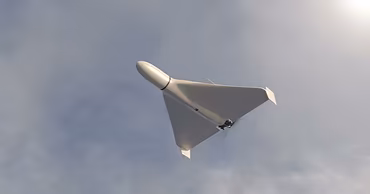 A Shahed-type kamikaze drone flying in the sky.
