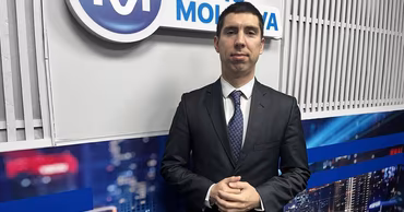 Andrei Pavaloi standing in a radio studio.