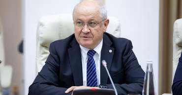 Alexandru Ursu, head of ANRE, sitting at a table during a meeting.