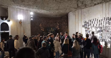 A group of tourists visiting the underground wine cellars of Cricova in Moldova.