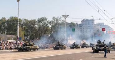 Military tanks participating in a parade on the Great National Assembly Square in Chisinau.
