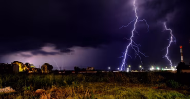 Lightning strikes during a night thunderstorm over a field in Moldova.