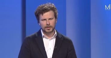 Dan Perciun, Minister of Education and Research of Moldova, in a studio setting.